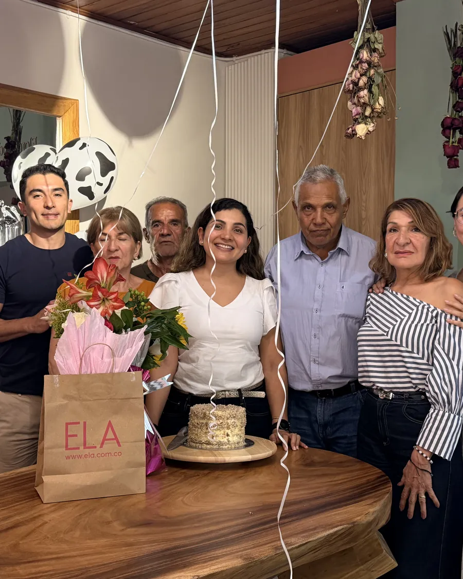 A birthday at the studio — Cake, flowers and the whole family around the big table.