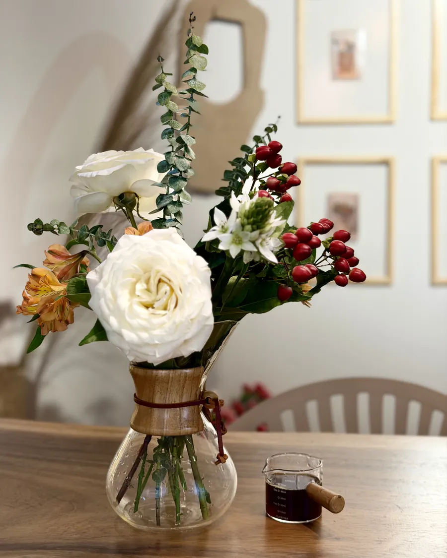 White rose and red berries — One of the arrangements that came off the table that afternoon.